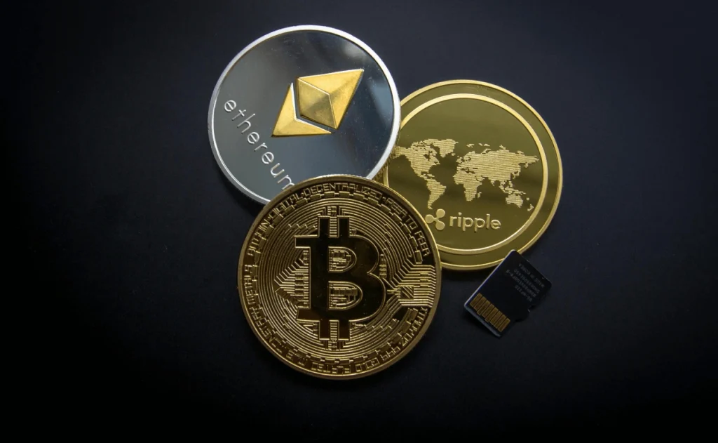 ethereum and bitcoin coins together Physical Ethereum and Bitcoin coins placed side by side representing digital currency adoption